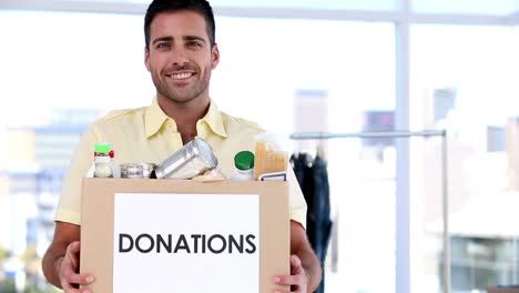 Volunteer-holding-a-donation-box