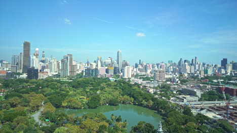 panoramic view of bangkok skyscrapers from lumpini or lumphini park