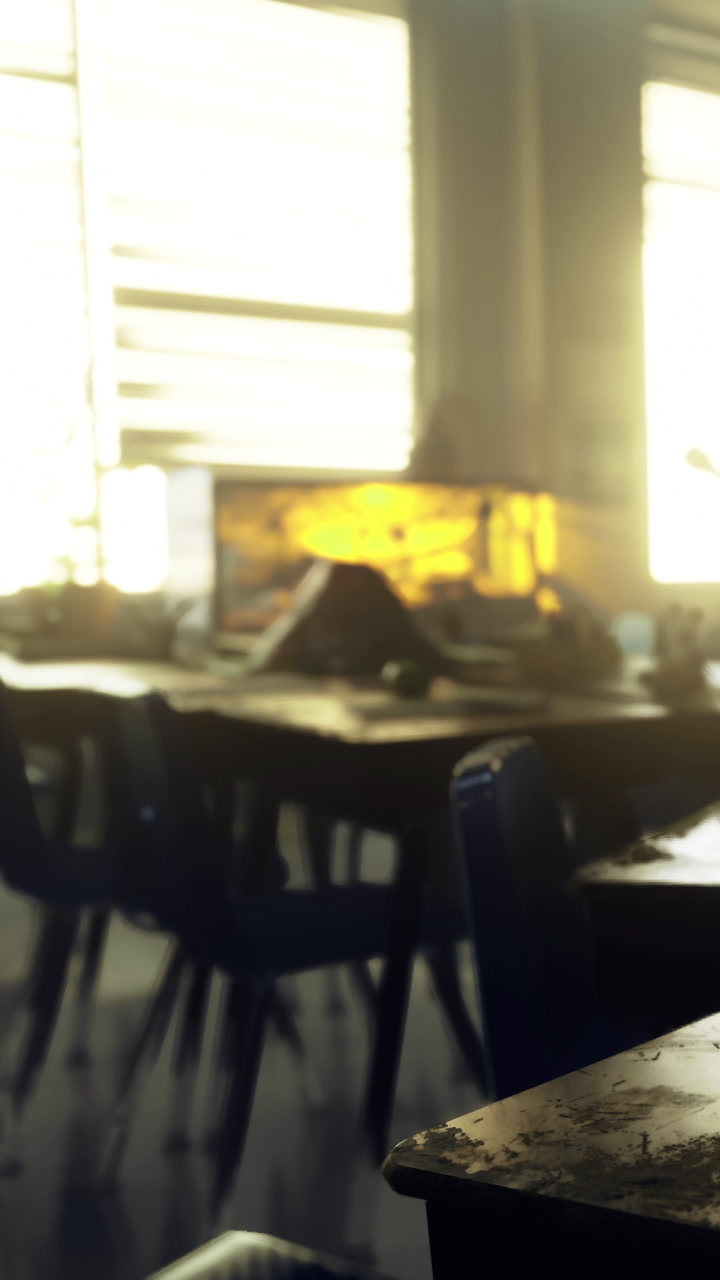 Classroom during evening light with empty tables and chairs