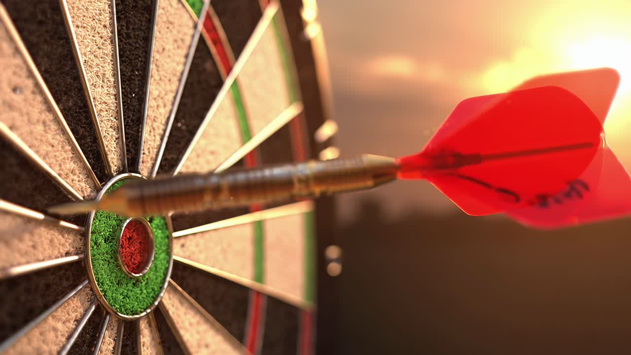 Close-up, angled shot of a dart hitting bullseye, capturing focus and precision in video