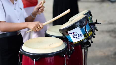 students playing conga drums