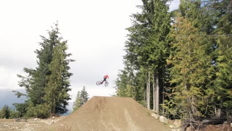 downhill biker jumping no hands slow motion