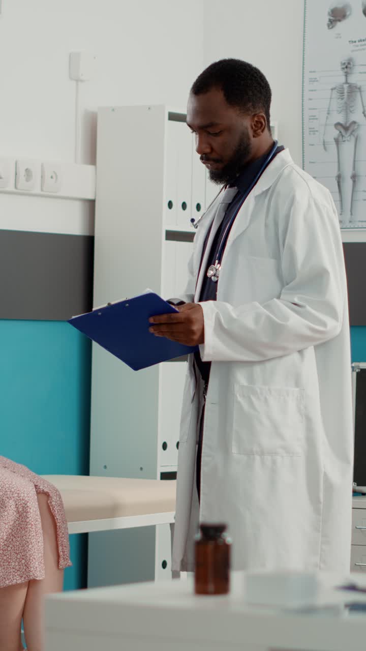 Pregnant woman with doctor in clinic