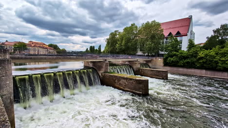 Ludwigswehr Dam with Cascading Water and Bridge on Isar River in Landshut, Germany
