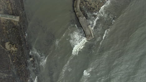 an aerial view of st monans famous zig-zag breakwater and harbour, fife, scotland