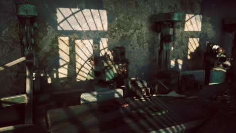shadows and textures inside an abandoned industrial workshop at dusk