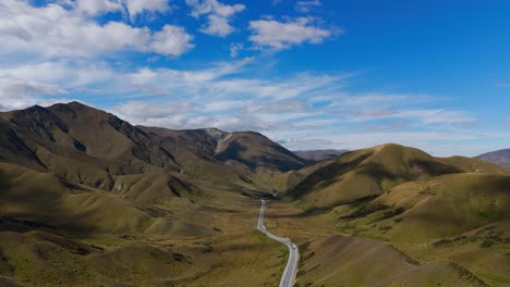 Aerial-establishing-shot-of-Linda-Pass-with-green-yellow-mountain-landscape-in-summer