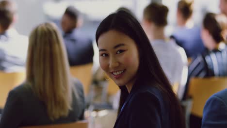 -Businesswoman-looking-at-camera-during-seminar-4k