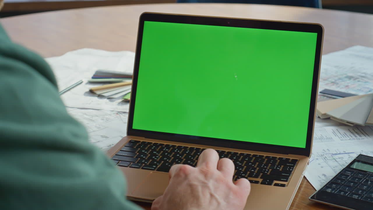 Engineer developing project greenscreen laptop sitting agency office closeup