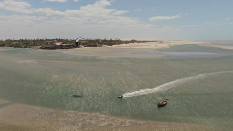 Kitesurfer-riding-fast-and-jumping-in-the-Tatajuba-lagoon