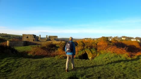 male hiker hiking in countryside 4k