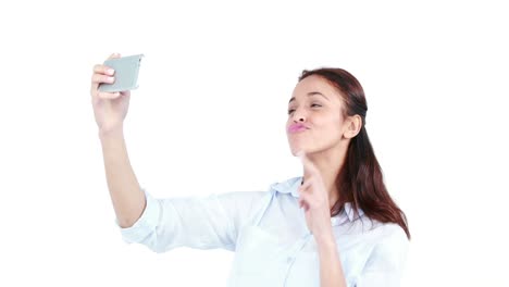 Casual-smiling-woman-taking-selfie