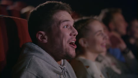 man laughing in the cinema