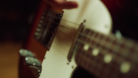 musician playing rock music in studio. guitarist making concert program indoor.