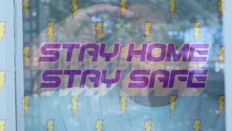 Animation of stay home stay safe with thunders over worried senior man at home