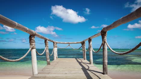 wood bridge on the beach near the ocean timelapse