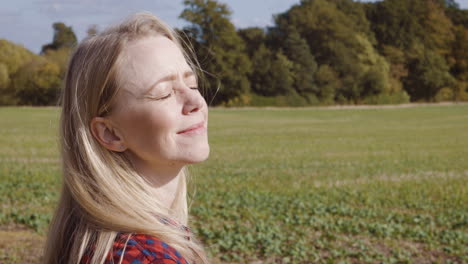 a woman enjoying nature in a field