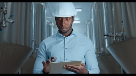 engineer inspecting brewery equipment