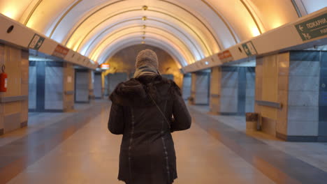 woman in subway tunnel