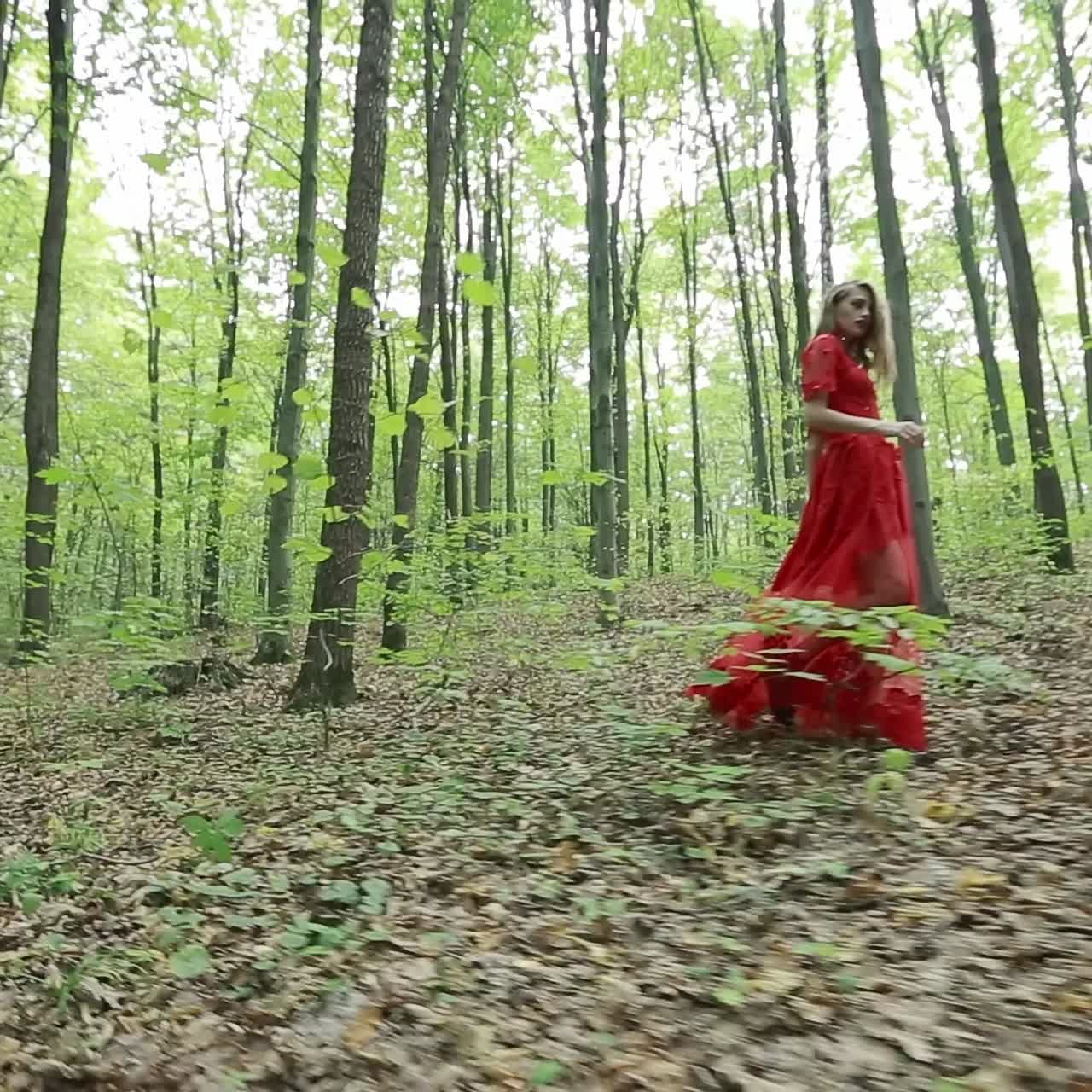 Woman Walking Away Alone On A Forest