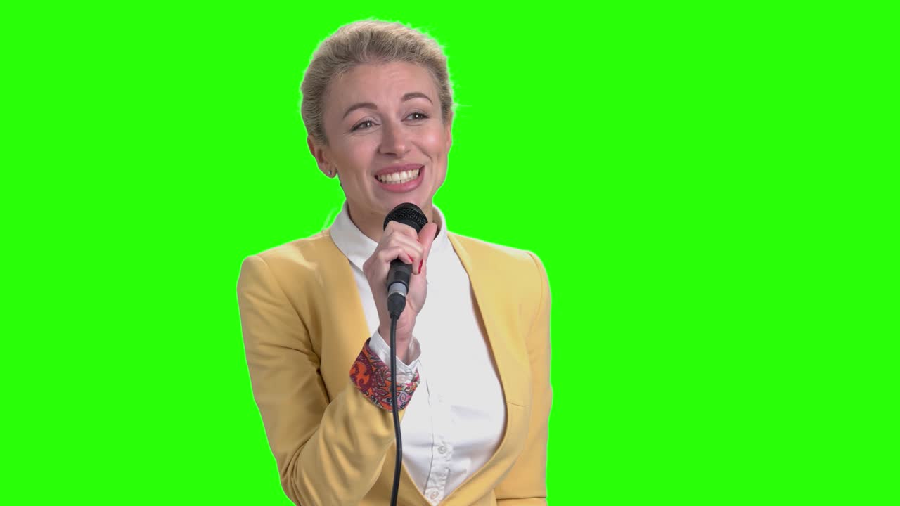 Young pretty woman talking with microphone.