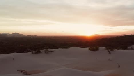 Aerial:-Sunset-at-the-dunes-of-Cumbuco,-Brazil