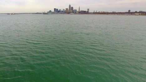 cinematic revealing drone shot of downtown cleveland ohio starting on lake erie