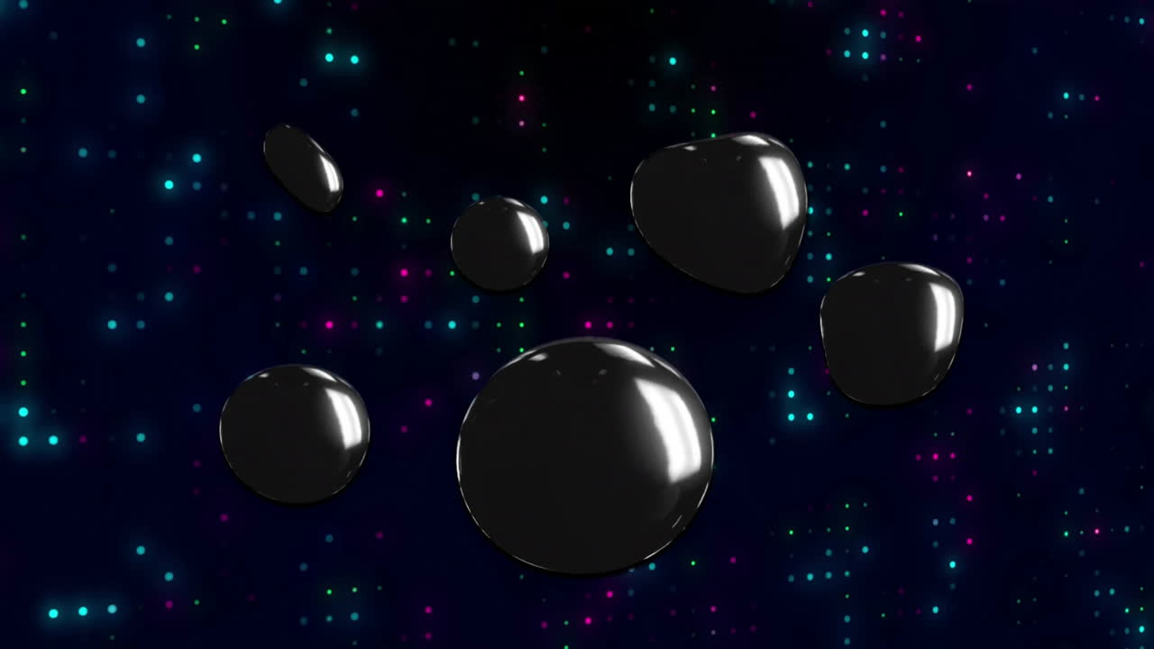 Floating shiny black spheres over colorful animation on dark background