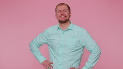 man smiling excitedly and pointing to camera choosing lucky lottery winner indicating to awesome you