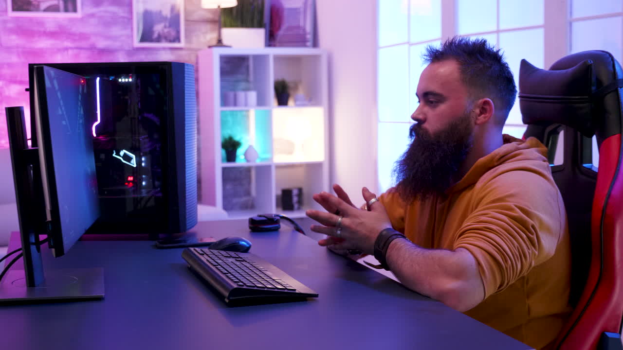 Gamer in front of his gaming computer