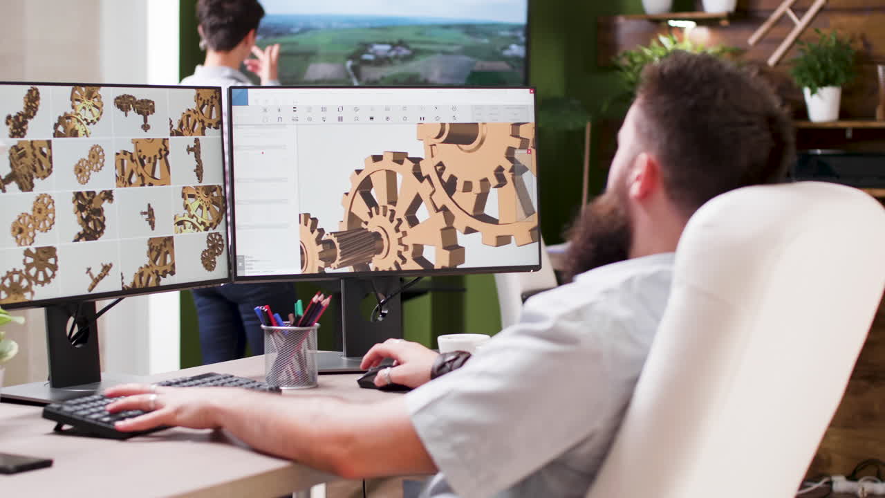 Man designing 3D model on computer