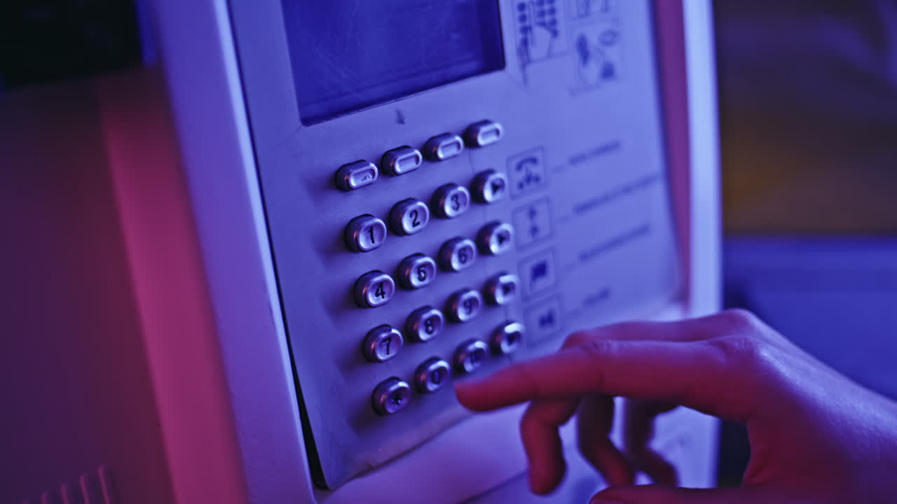 Neon woman hand calling payphone at call box closeup. Lady pressing buttons