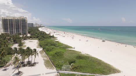 sandy south beach aerial reveals row of waterfront apartment buildings