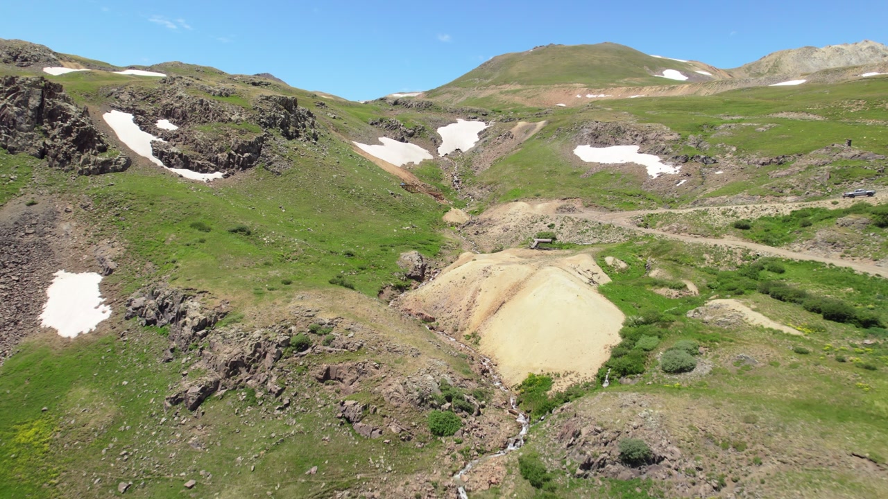 Revealing Drone Shot of Engineer Pass Off Road Trail and old mines in the San Juan Mountains, Colorado in the Summertime