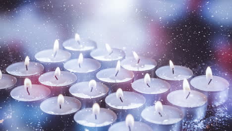 falling snow with christmas candles