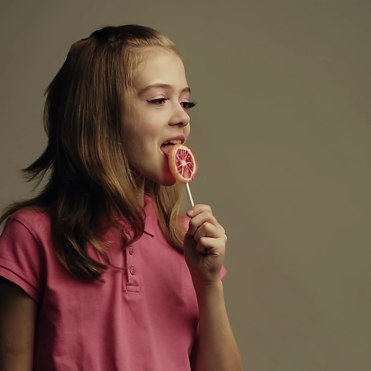Girl with lollipop candy | Premium Stock Video Footage