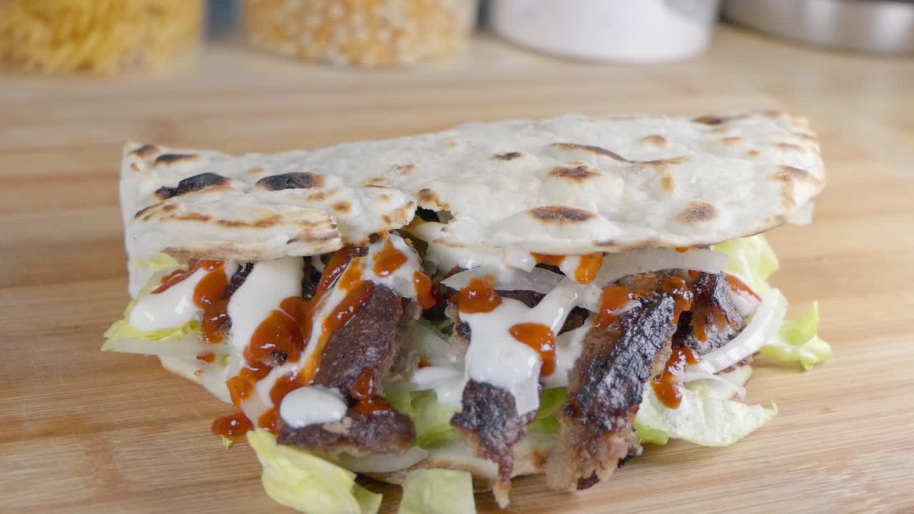Slider Shot of a Doner Kebab in Naan Bread at Home on the Kitchen Counter