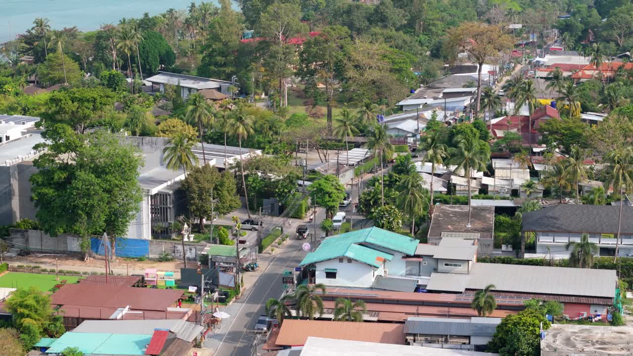 aerial drone footage of big hotel on Koh Chang island, Kai Bae village with roads, shops , hotel accommodation