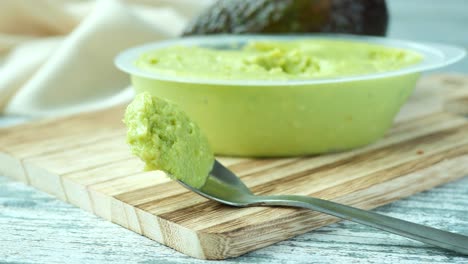 avocado spread on a chopping board ,