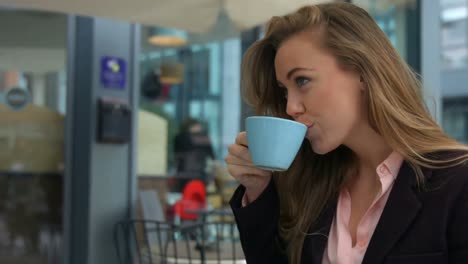 businesswoman enjoying a coffee in cafe