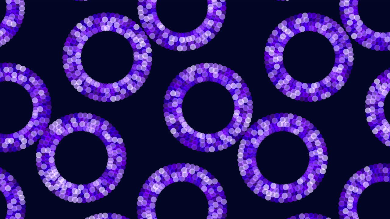 Circular pattern of vibrant blue circles against a black backdrop creates a visually striking and symmetrical design. The concentric arrangement of overlapping circles forms an intricate