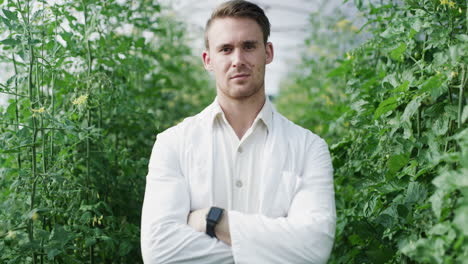 portrait of a scientist in a greenhouse