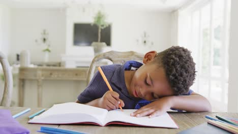 Happy-african-american-boy-having-online-lesson,-in-slow-motion