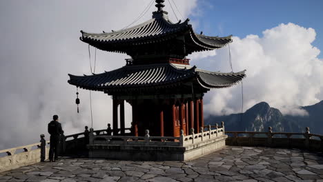 traditional pagoda on a mountain top amidst clouds