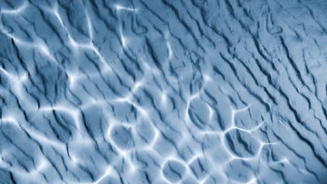 water reflection light pattern on wrinkled blue sand surface. abstract natural overlay with wavy lines and sunlight ripple effect. design for wallpaper, banner, postcard, greeting card, poster,