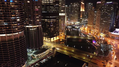 aerial view of the chicago loop at night. shot along the chicago river.