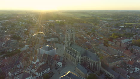 aerial view of cathedral, basilica of our lady in tongeren, belgium with sun flare