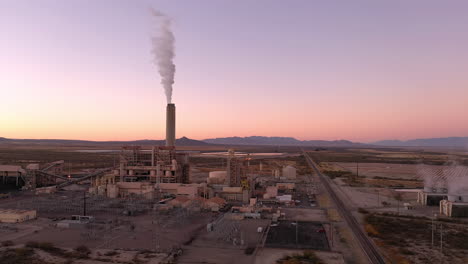 willcox arizona power plant with white smoke out of chimney, aerial 4k