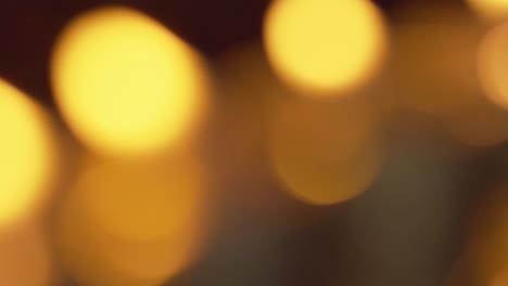 Defocused-bokeh-from-candle-flames-glowing-and-shimmering-in-the-gentle-breeze