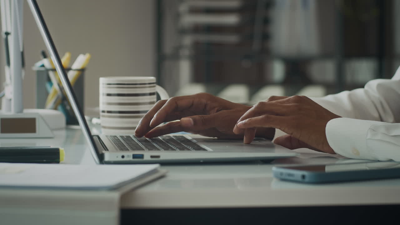 Hands of Manager Texting Email on Laptop at Office Desk